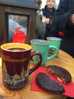 Glühwein (hot wine aka Mulled Wine). Disposable cups are not allowed here. Everything is sold in these cute mugs. There's a €3 deposit, or you can keep the mug. That ginger cookie was amazing.